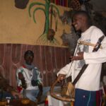 An azmari musician performing in a tej bet