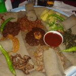 Beyaynetu, a mixed vegetarian platter on injera
