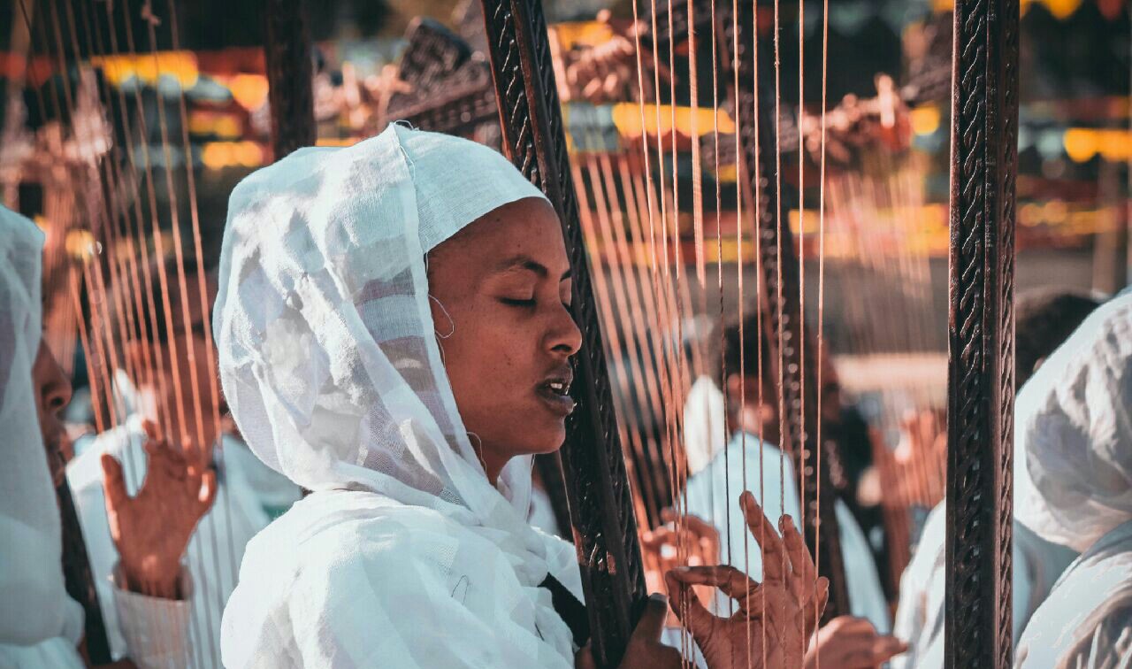 Musician playing a begena, the large Ethiopian lyre