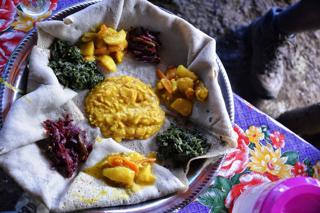 Injera with vegan fasting dishes