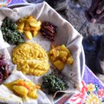 A shared plate of injera and fasting dishes